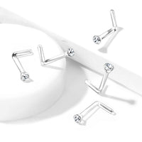 Meerdere Bioflex neuspiercings met helder kristal